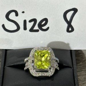 3CT Green Peridot ring! Set in sterling silver with 1.5CT CZ accents!